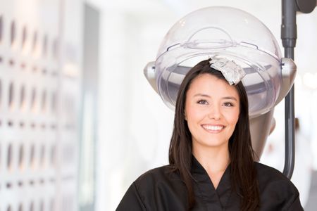 Woman at the hair salon changing her color