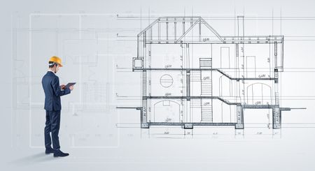 Architect watching a 2 dimension house plan