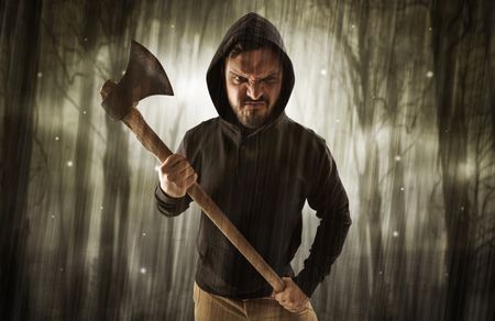 masked-armed-hitman-dark-thick-forest-1354531667 Masked armed hitman in dark thick forest with foggy mysterious concept