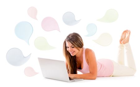 Woman chatting on a laptop using social networks - isolated over a white