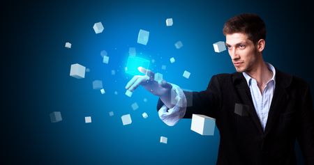 Man touching hologram screen displaying cube symbols