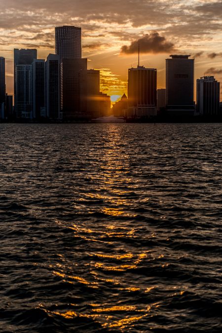 Beautiful sunset in Miami with the sun between buildings