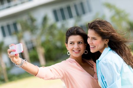 Women taking a picture of themselves with the mobile phone