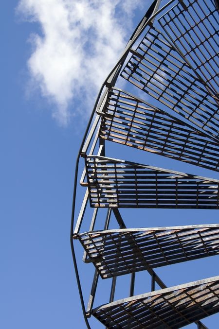 Spiral staircase to blue sky