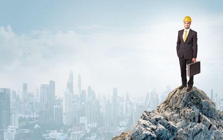 Young architect looking to the big the city from distance