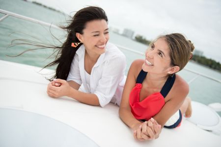 Beautiful girls on a boat talking and looking very happy