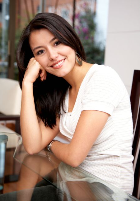 Casual woman portrait relaxing and smiling at home