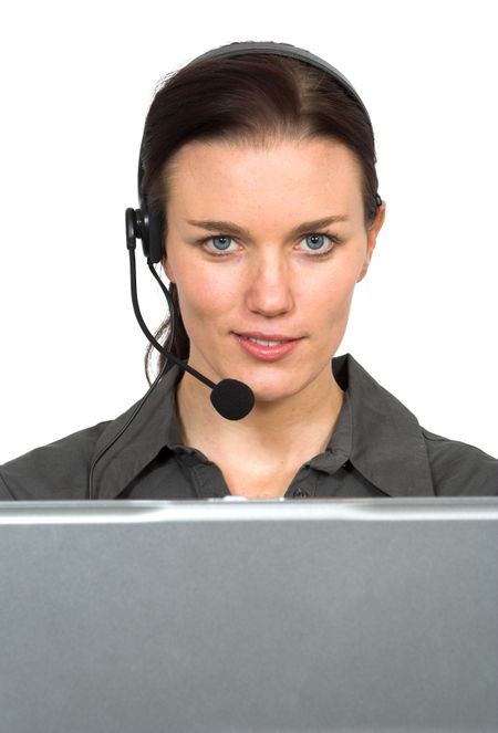 beautiful customer support girl in front of laptop in an office