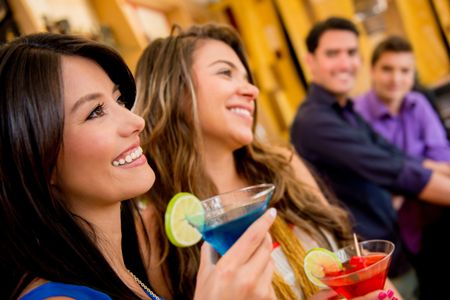 Group of people at the bar having a drink