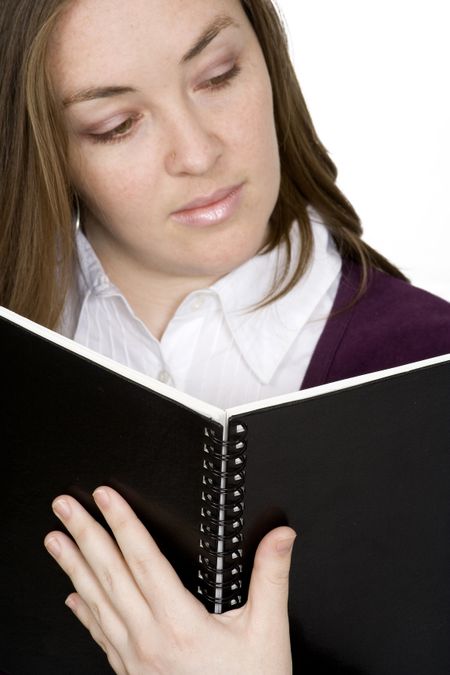 student reading over white - focus on notebook