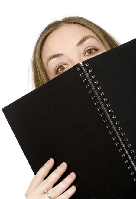 studying peeping over notebook over white