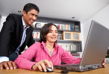 business people working on a laptop computer isolated over a white background