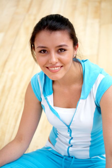 portrait of a woman smiling at the gym