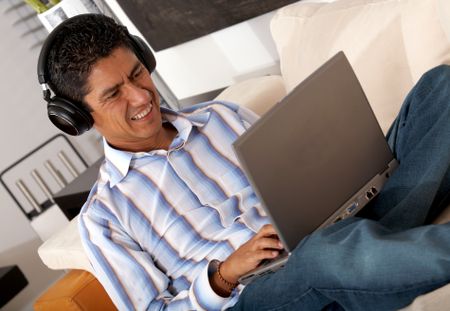 man at home on his laptop computer