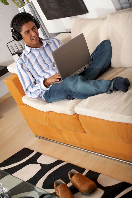 man working on his laptop at home