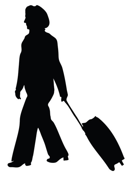 business woman walking along with her suitcase - silhouette isolated over a white background