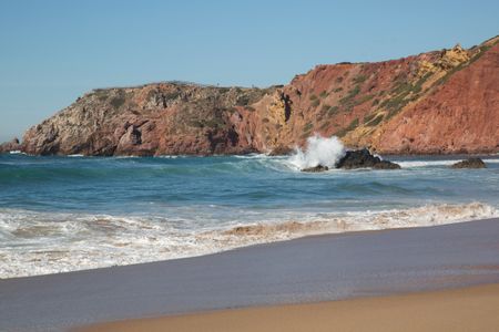 Wave Crashing on  Rock at Amado Beach, Algarve; Portugal