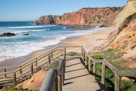 Stairs down to Amado Beach with Cliffs in the Algarve; Portugal