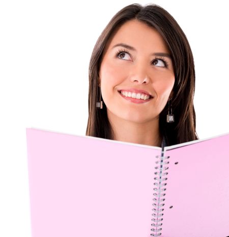 Pensive female student holding notebook - isolated over white