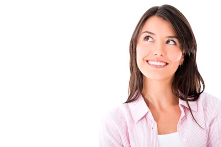 Thoughtful woman portrait smiling - isolated over a white background