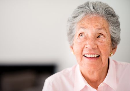 Portrait of a thoughtful elder woman smiling