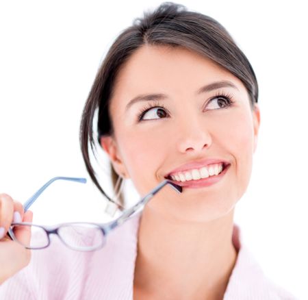 Thoughtful woman portrait holding glasses - isolated over white