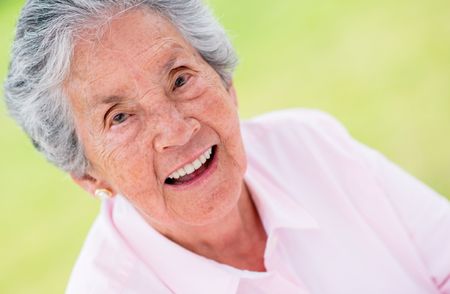 Portrait of a happy elder woman smiling outdoors