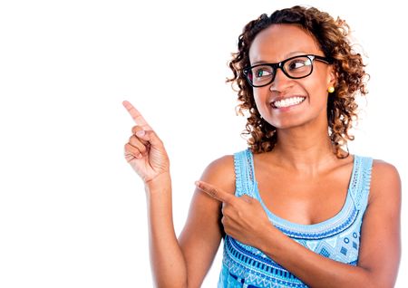 Happy woman pointing to the side - isolated over a white background