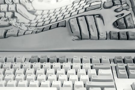 Computer keyboard and its distorted reflection