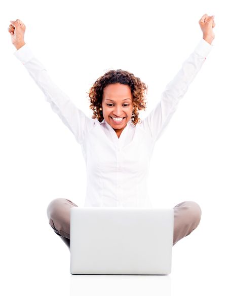 Successful business woman working on a laptop - isolated over white