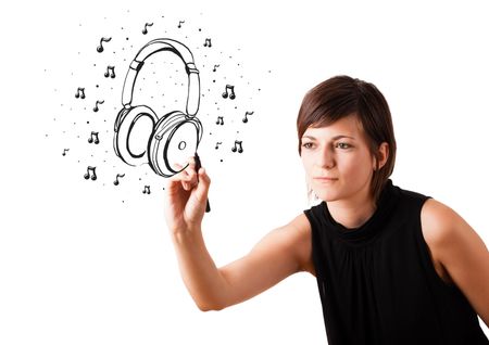 Young girl drawing headphone and musical notes isolated on white