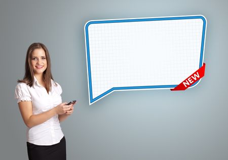 beautiful young woman holding a phone and presenting modern speech bubble copy space