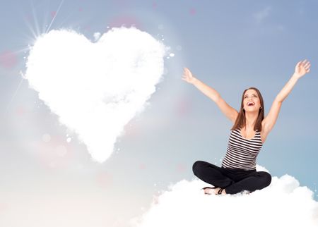 Beautiful young lovely woman sitting on cloud with heart