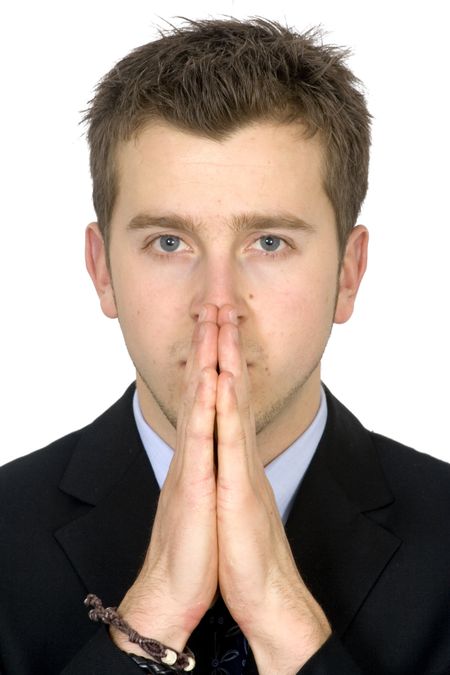 business man praying over white background