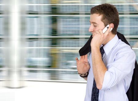 business on the move - cell phone conversation in a corporate environment
