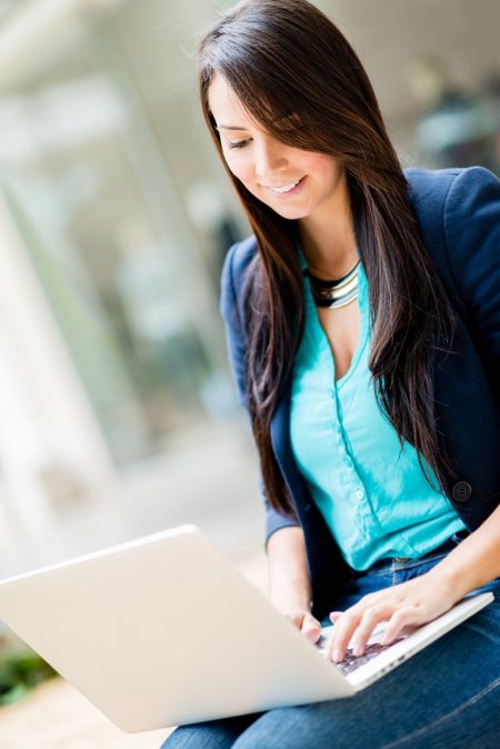 Successful business woman using a laptop computer