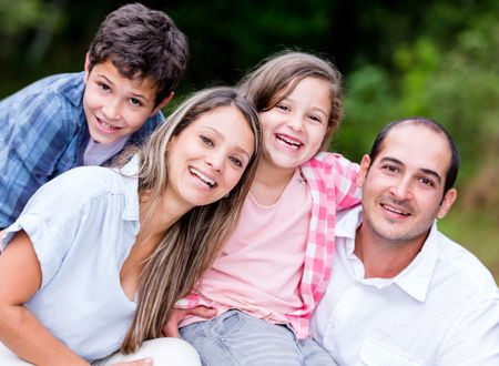 Beautiful family portrait spending time together outdoors