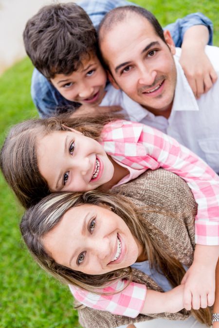 Portrait of a beautiful family looking very happy outdoors