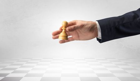 big-elegant-hand-taking-next-step-1413605405 Big elegant hand taking his next step on chess game