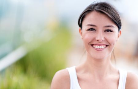 Portrait of a happy young woman smiling