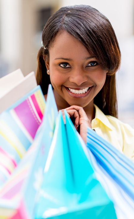 Portrait of a happy shopping woman smiling