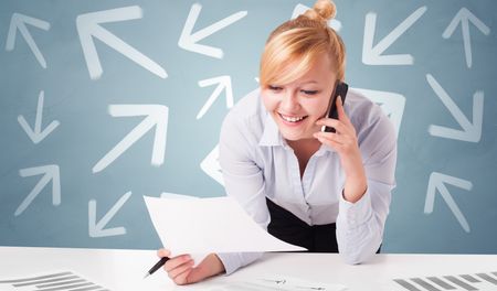 Business person sitting at desk with different direction concept