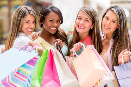 Happy group of shopping women wish bags and smiling