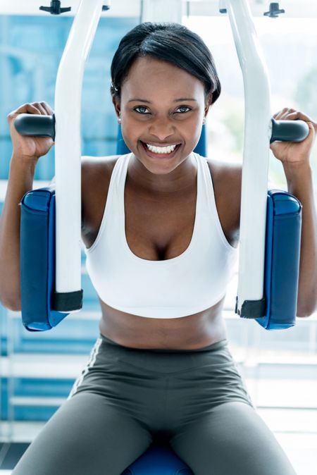 Woman at the gym working out on a machine