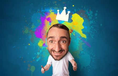 Funny person with big head and drawn crown