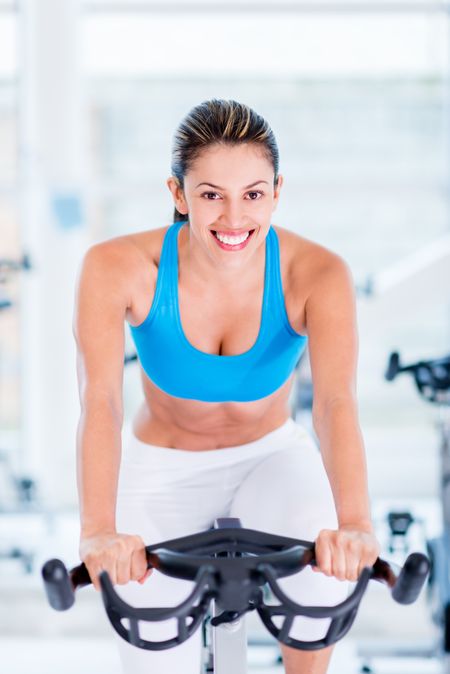 Fit woman  at the gym looking very happy