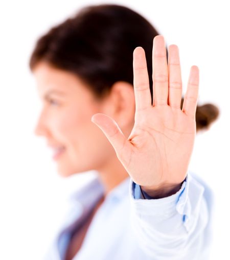 Business woman making Talk to the hand gesture - isolated over white