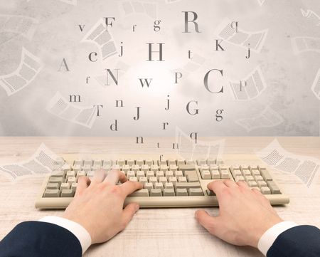 First person view of an elegant businessman hand  typing with fluttering papers around