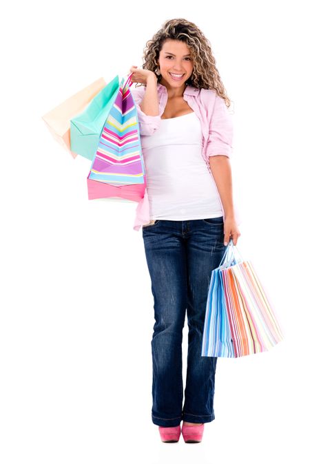Shopping woman smiling - isolated over a white background