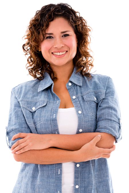 Casual woman smiling with arms crossed - isolated over white background